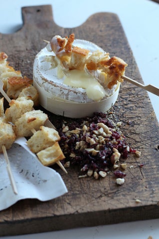 Hot camembert with cranberries and roasted hazelnuts