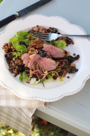Grilled duck breast on lentil, olive and walnut salad