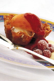 Peaches With Raspberry Liqueur Sauce In Brandy Snap Baskets