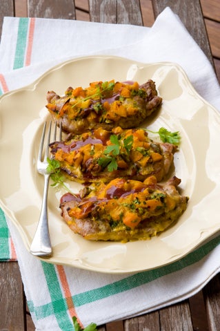 Baked apricot and pistachio-stuffed pork steaks with pinot noir jus