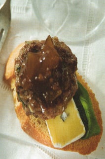 Mini beef and cambozola burgers on crostini