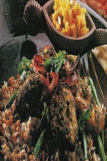 Golden chicken on a salad bed of mixed grains