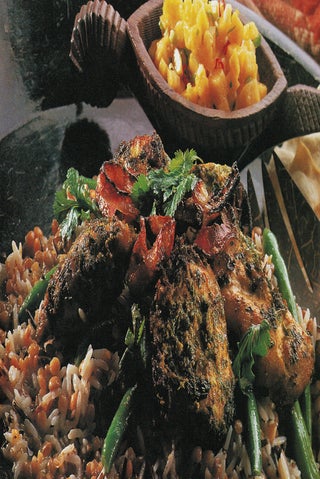 Golden chicken on a salad bed of mixed grains