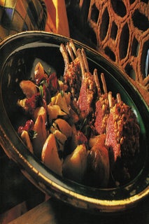 Pinenut and rosemary crusted lamb with roasted tomato and olive sauce