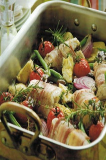 Baked hoki with artichokes and tomatoes
