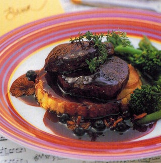 Venison steaks with bacon potato cakes and cassis